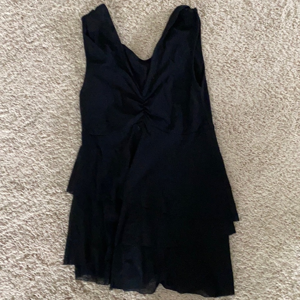 Adorable 3 tiered ruffle blouse. Very flattering